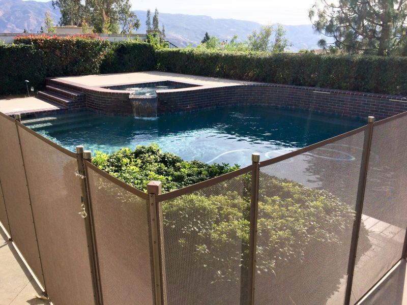 Removable Mesh Pool Fence in Use